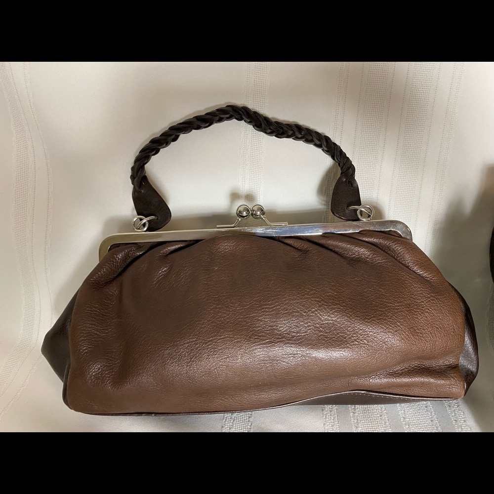 Brown leather hand bag with silver balls that clasp- Cee-Klein. Braided strap